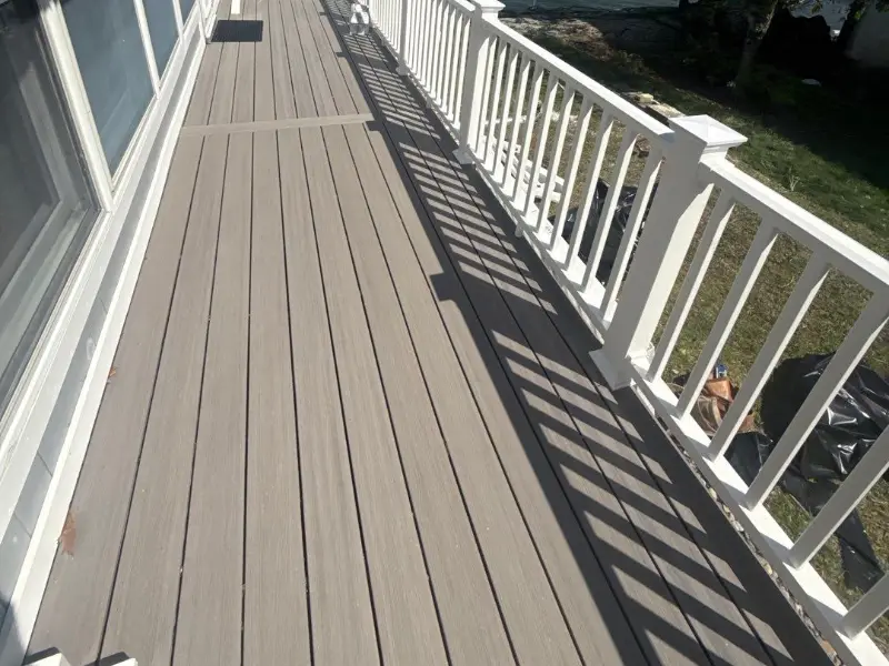 Composite deck with white railings on a lakefront home in Hopatcong NJ