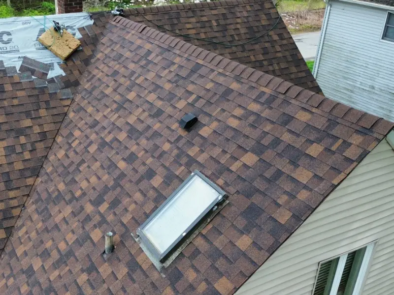 New architectural shingle roof with a skylight, replaced by Herts in Norwood NJ